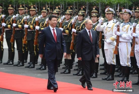   5月20日，中國國家主席習近平在上海舉行儀式歡迎俄羅斯總統普京訪華。中新社發 廖攀 攝
